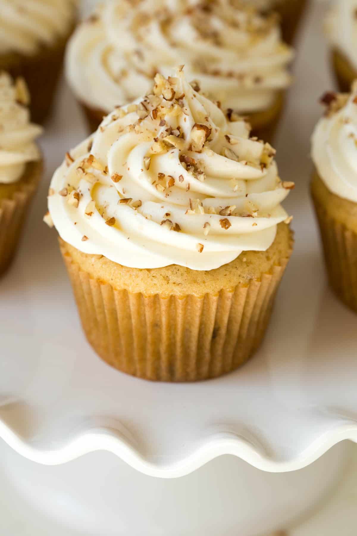 one maple cupcake with maple cream cheese frosting