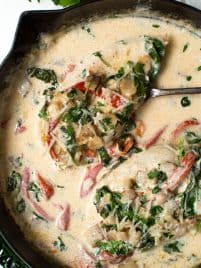 Creamy Chicken Bacon Skillet with Spinach and Roasted Red Peppers is a flavorful one pan meal that is ready in less than 30 minutes!