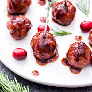 Every party needs a good meatball and these Rosemary Turkey Meatballs with Cranberry Balsamic Sauce are sure to be a crowd pleaser this holiday season! #meatballs #appetizer #turkey #cranberry #glutenfree