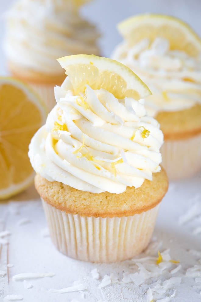 Lemon Coconut Cupcakes with Vanilla Buttercream Frosting are a delectable treat packed with the freshest lemon flavor! Bake a dozen to share with your friends and family. #meyer #lemon #cupcakes #dessert 