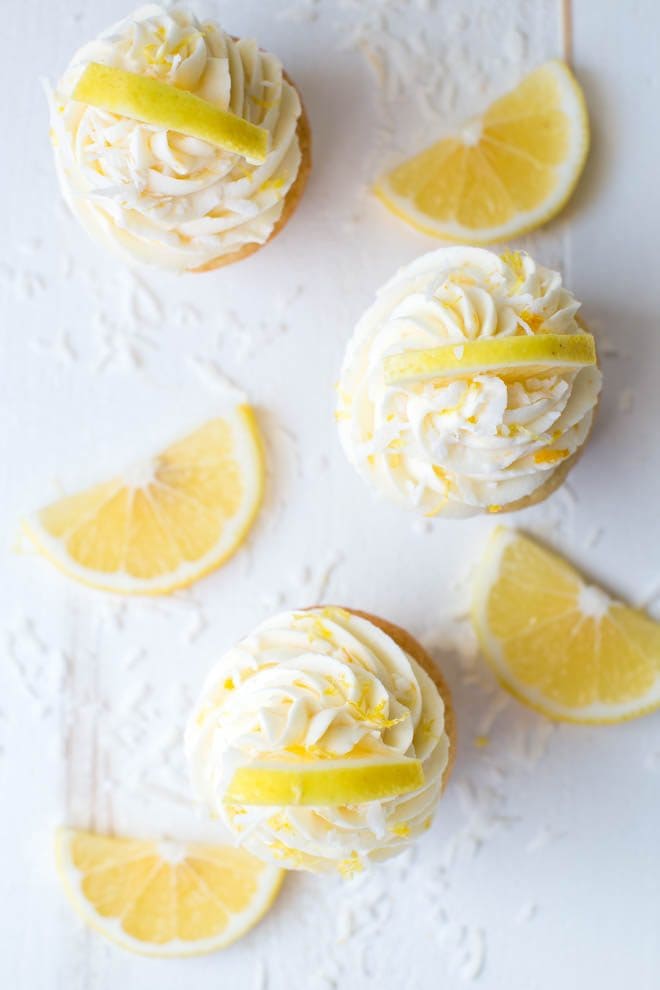 Lemon Coconut Cupcakes with Vanilla Buttercream Frosting are a delectable treat packed with the freshest lemon flavor! Bake a dozen to share with your friends and family. #meyer #lemon #cupcakes #dessert #recipe #cupcakerecipe