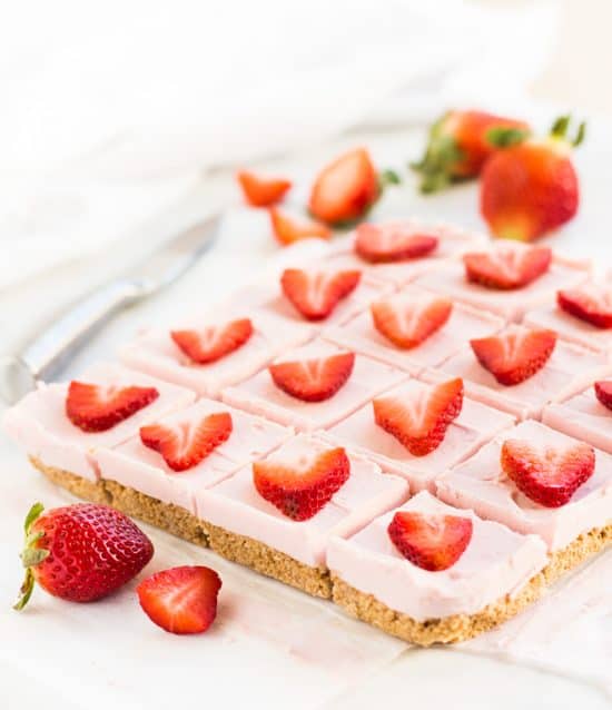 Strawberry cheesecake bars with graham cracker crust is a no bake recipe for Valentine's Day #cheesecake #dessert