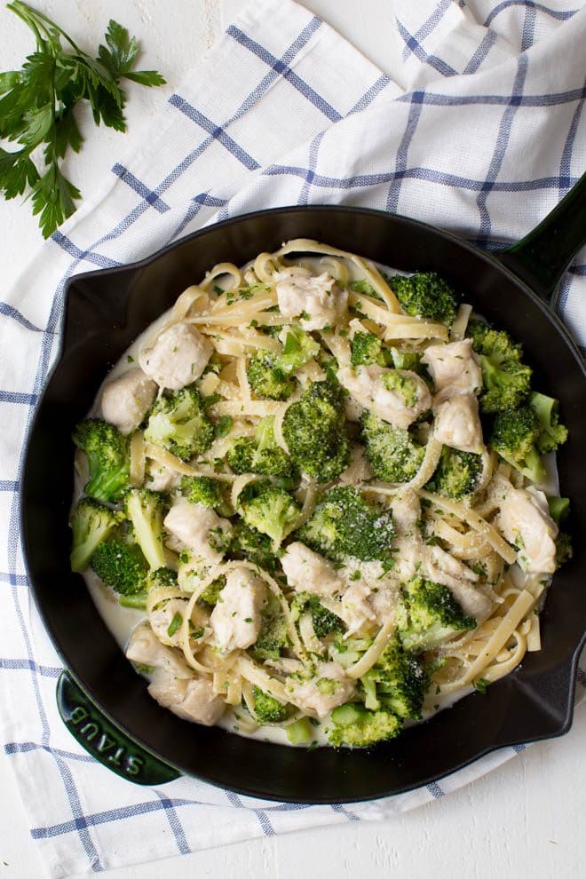 Lightened Up One Pan Chicken and Broccoli Fettuccine Alfredo is a healthier twist on classic chicken Alfredo pasta. It is cooked in one pan and lightened up to make it an easy yet satisfying meal for any day of the week!