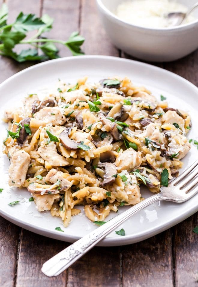 Parmesan Herb Chicken, Mushroom and Orzo Skillet is a one pan, easy to make, comfort food dinner the whole family will love! #dinner #easyrecipe #chicken #orzo