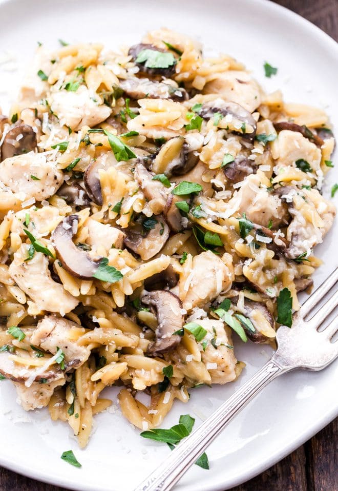 Parmesan Herb Chicken, Mushroom and Orzo Skillet is a one pan, easy to make, comfort food dinner the whole family will love! #dinner #easyrecipe #chicken #orzo