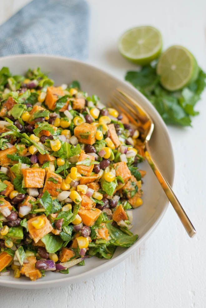Southwest Sweet Potato Chopped Salad is made with roasted sweet potatoes, black beans, corn, red onion, avocado and chopped greens. It is served with fresh avocado cilantro dressing! #southwest #sweetpotato #chopped #salad #healthy #recipe #organicgirl #avocado #cilantro #dressing #healthyrecipe #lunch #dinner