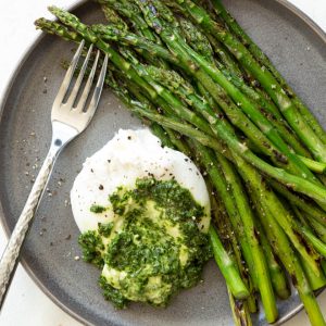 Asparagus with Burrata Cheese and Kale Pesto is a quick, easy and impressive appetizer, snack or lunch option that is ready in less than 25 minutes! Burrata cheese and kale pesto is served with sautéed asparagus to create a nutrient-rich dish that is enjoyed any time of the year. #Akins #asparagus #burrata #pesto #sidedish #healthyrecipe #recipe #spring