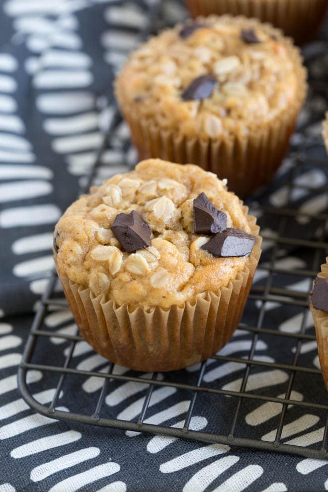 chocolate chunk oatmeal muffins sitting on a baking rack