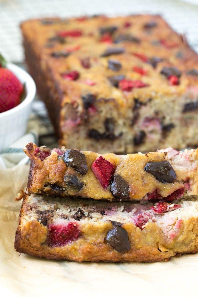 Paleo Chocolate Chunk Strawberry Banana Bread is made in one bowl and comes together easily! The bread is made with fresh strawberries and is naturally gluten free. #glutenfree #bread #strawberry #paleo #healthyrecipe 