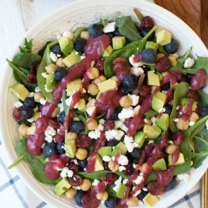 Combine the freshest flavors to create this Cranberry Blueberry and Goat Cheese Salad with Cranberry Vinaigrette Dressing. Pack in a mason jar for on-the-go or serve in a large bowl for a crowd. This antioxidant packed salad will please everyone! #salad #recipe #cranberry