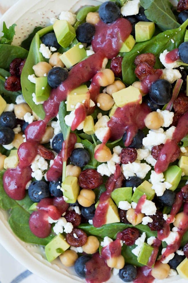 Combine the freshest flavors to create this Cranberry Blueberry and Goat Cheese Salad with Cranberry Vinaigrette Dressing. Pack in a mason jar for on-the-go or serve in a large bowl for a crowd. This antioxidant packed salad will please everyone! #salad #recipe #antioxidants