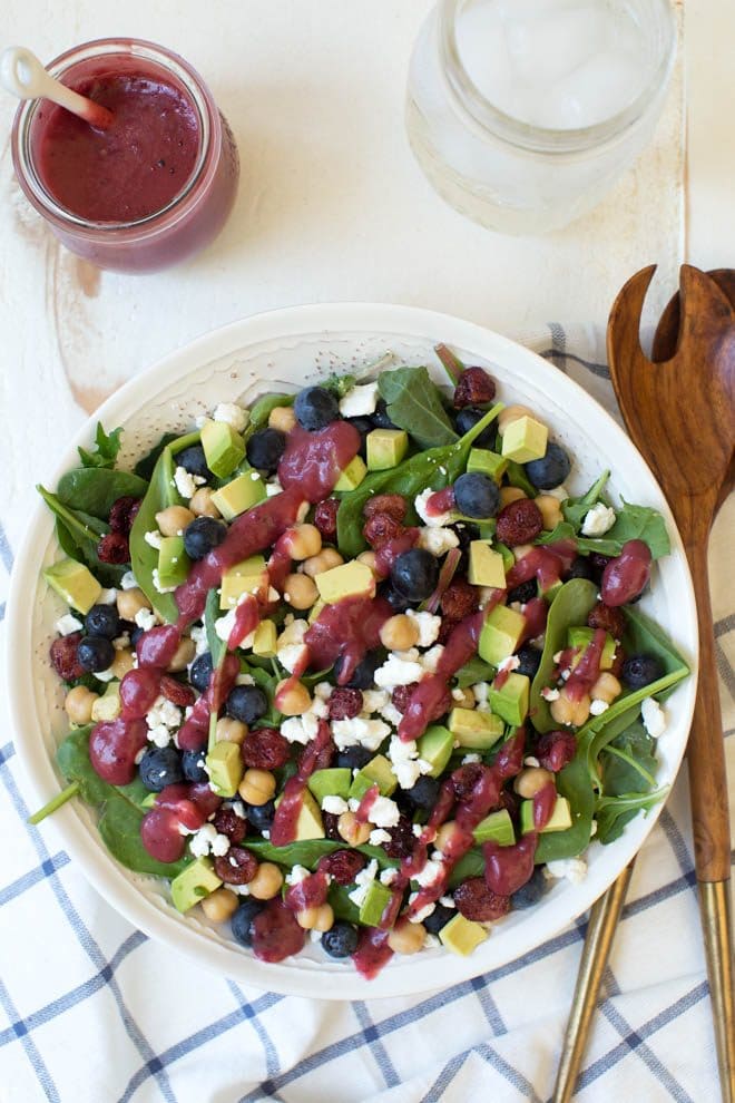 Combine the freshest flavors to create this Cranberry Blueberry and Goat Cheese Salad with Cranberry Vinaigrette Dressing. Pack in a mason jar for on-the-go or serve in a large bowl for a crowd. This antioxidant packed salad will please everyone! #cranberry #blueberry #salad #wisconsin #cranberries #lunch #recipe #masonjar #mealprep