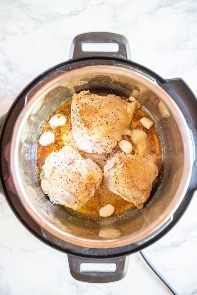 Lemon Garlic Butter Chicken Thighs are made in the Instant Pot with a few simple ingredients! The recipe is low carb and packed with flavor. #instantpot #chicken #recipe