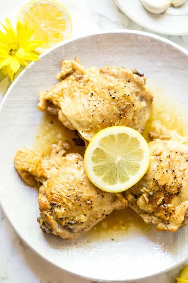 Lemon Garlic Butter Chicken Thighs are made in the Instant Pot with a few simple ingredients! The recipe is low carb and packed with flavor. #healthy #chicken #recipe #instantpot #lowcarb #dinner