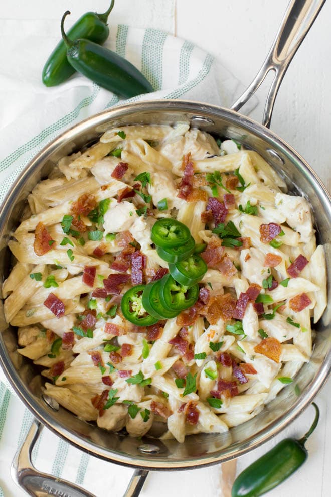 One Pot Creamy Jalapeño Popper Chicken Pasta combines your favorite jalapeño popper flavors in one creamy and delicious meal! Cooked in only one pot, this easy weeknight dinner is perfect for the entire family.  #jalapeno #popper #chicken #pasta #onepot #dinner #recipe #weeknight #skillet #meal #familydinner