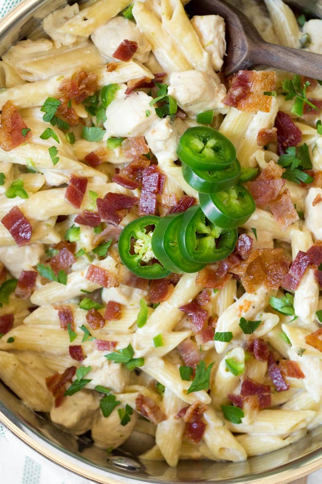 One Pot Creamy Jalapeno Popper Chicken Pasta combines your favorite jalapeño popper flavors in one creamy and delicious meal! Cooked in only one pot, this easy weeknight dinner is perfect for the entire family.  #jalapeno #popper #chicken #pasta #onepot #dinner #recipe #weeknight #skillet #meal