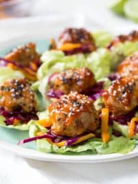 Wrap saucy chicken meatballs and fresh mango slaw with crunchy butter lettuce to create these Asian Chicken Meatball Lettuce Wraps with Mango Slaw! Enjoy them for lunch, dinner or as an appetizer. #chicken #meatballs #dinner #lunch #appetizer #asian #healthy #recipe #mango