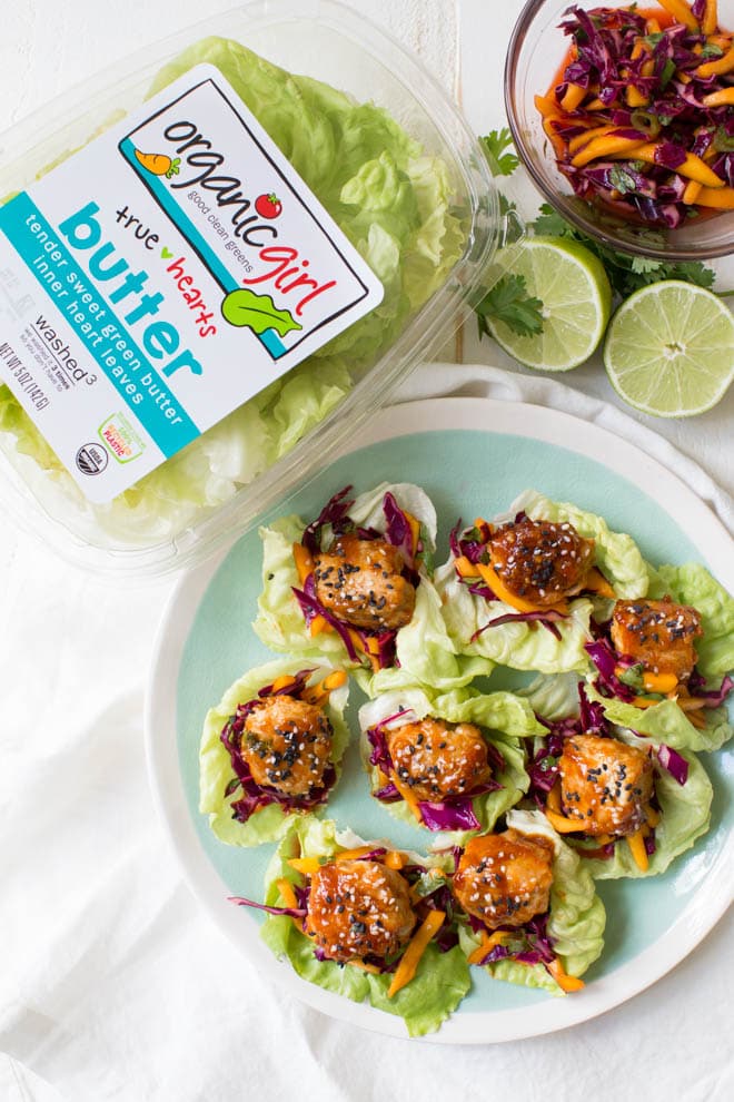 Wrap saucy chicken meatballs and fresh mango slaw with crunchy butter lettuce to create these Asian Chicken Meatball Lettuce Wraps with Mango Slaw! Enjoy them for lunch, dinner or as an appetizer. #chicken #meatballs #dinner #lunch #appetizer #asian #healthy #recipe