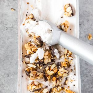 No Churn Coconut Milk Vanilla Ice Cream is made with only four ingredients and is topped with delectable chunks of Atkins Harvest Trail Dark Chocolate Sea Salt Caramel Bar! This dessert is low carb and naturally gluten free. #icecream #coconutmilk #summer #dessert #lowcarb #recipe #Atkins #chocolate