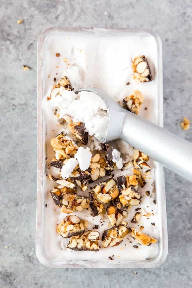 No Churn Coconut Milk Vanilla Ice Cream is made with only four ingredients and is topped with delectable chunks of Atkins Harvest Trail Dark Chocolate Sea Salt Caramel Bar! This dessert is low carb and naturally gluten free. #icecream #coconutmilk #summer #dessert #lowcarb #recipe #Atkins #chocolate