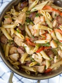 One Pot Jambalaya Pasta packs a ton of flavor with its classic Cajun taste! Cooked in just one pot, this is the perfect no-mess meal for an easy, weeknight dinner the entire family will love. #onepot #jambalaya #pasta #skillet #dinner #recipe #weeknight #chicken