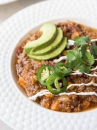 Instant Pot Turkey Chili with Sweet Potato and Quinoa is a healthier take on your favorite hearty chili! This meal is a fall favorite that the whole family will love and it cooks in the Instant Pot for an easy weeknight dinner. #turkey #chili #sweetpotato #instantpot #pressurecooker #dinner #recipe #weeknightmeal