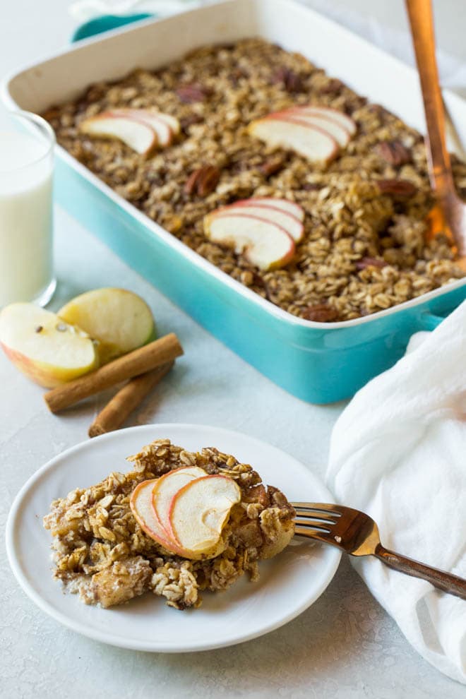 A plate with a scoop of baked oatmeal with apples