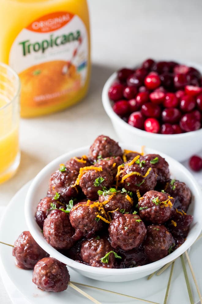 Combine only five ingredients together in the slow cooker to make these Crockpot Meatballs with Cranberry Sauce and Orange! Packed with fresh flavor, these meatballs are an easy appetizer for holiday parties or potluck dinners. #cranberry #orange #slowcooker #crockpot #meatballs #recipe