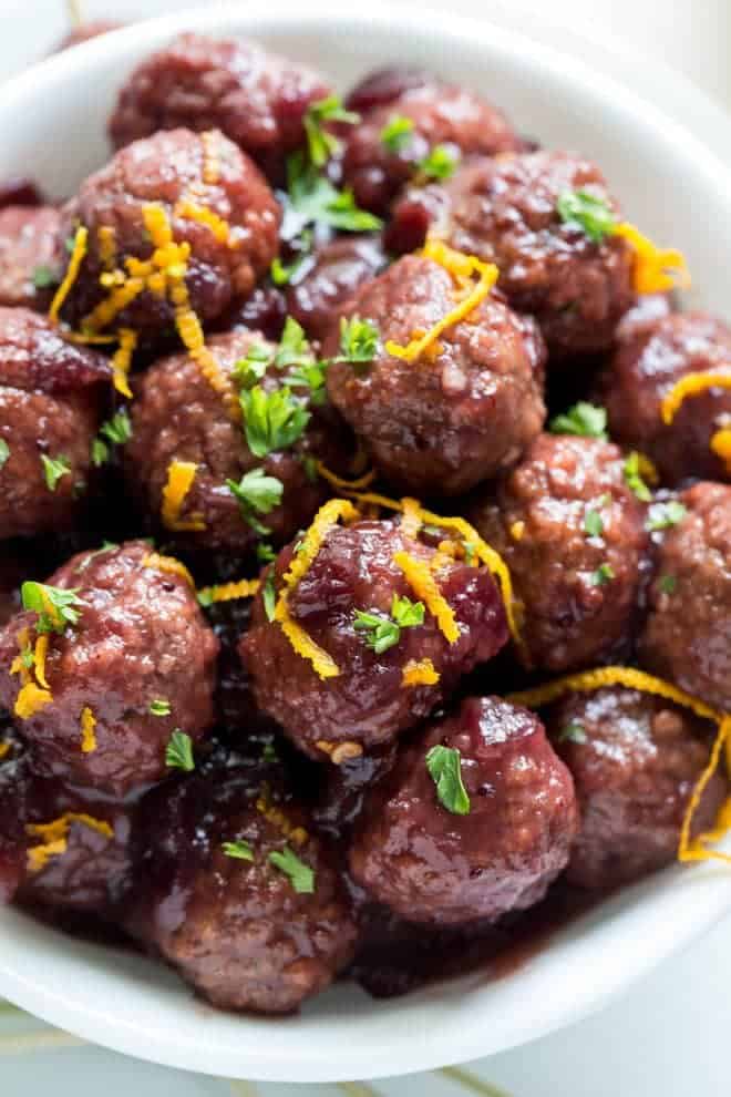 Combine only five ingredients together in the slow cooker to make these Crockpot Meatballs with Cranberry Sauce and Orange! Packed with fresh flavor, these meatballs are an easy appetizer for holiday parties or potluck dinners. #cranberry #orange #slowcooker #crockpot #meatballs #recipe #appetizer #holiday #dinner #parties