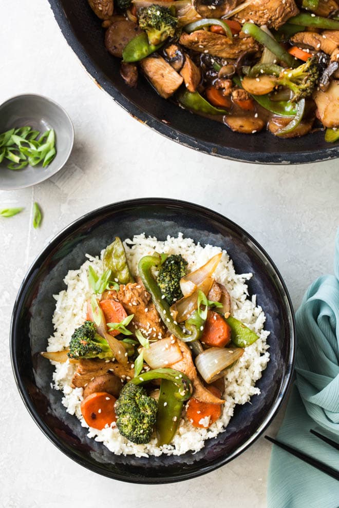 Garlic Sesame Chicken Stir Fry is an easy meal that’s on the table in 30 minutes or less and boasts an authentic Chinese stir-fry flavor! Skip take out to make this healthier stir fry at home. #sesame #chicken #stirfry #dinner #recipe #onepot #meal