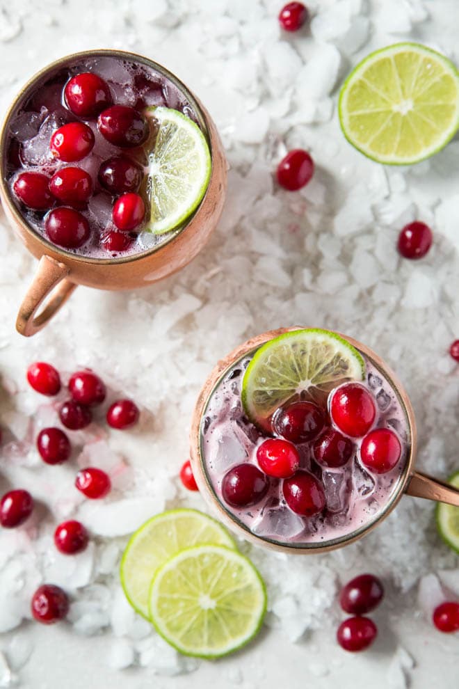 Shake up a Cranberry Moscow Mule and serve this festive holiday cocktail at your next dinner party or holiday celebration! #cranberry #moscow #mule #drink #recipe #holiday #rum #voldka