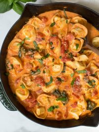 Combine a few simple ingredients to create a Creamy Tomato Basil Tortellini Skillet made in less than 30 minutes! The skillet is packed with fresh flavor and hearty ingredients. #tomato #basil #tortellini #pasta #skillet #dinner #recipe #creamy