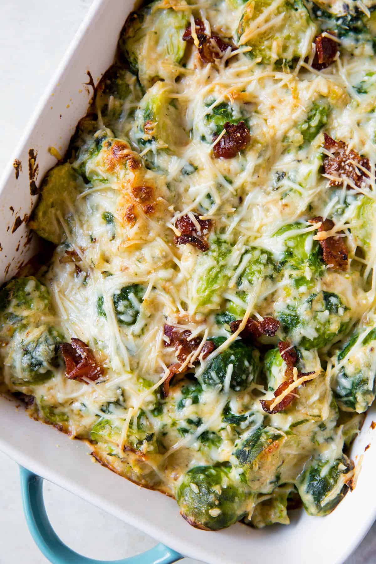 baked brussels sprouts gratin in a casserole dish