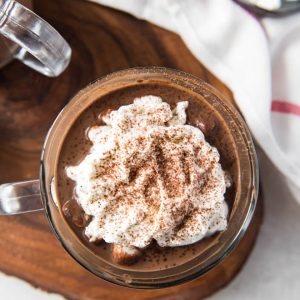 Homemade hot cocoa is the perfect sweet treat and drink to celebrate the holidays! This recipe cooks in the Instant Pot or Slow Cooker to make things easy for holiday entertaining. #hotcocoa #drink #holiday #recipe