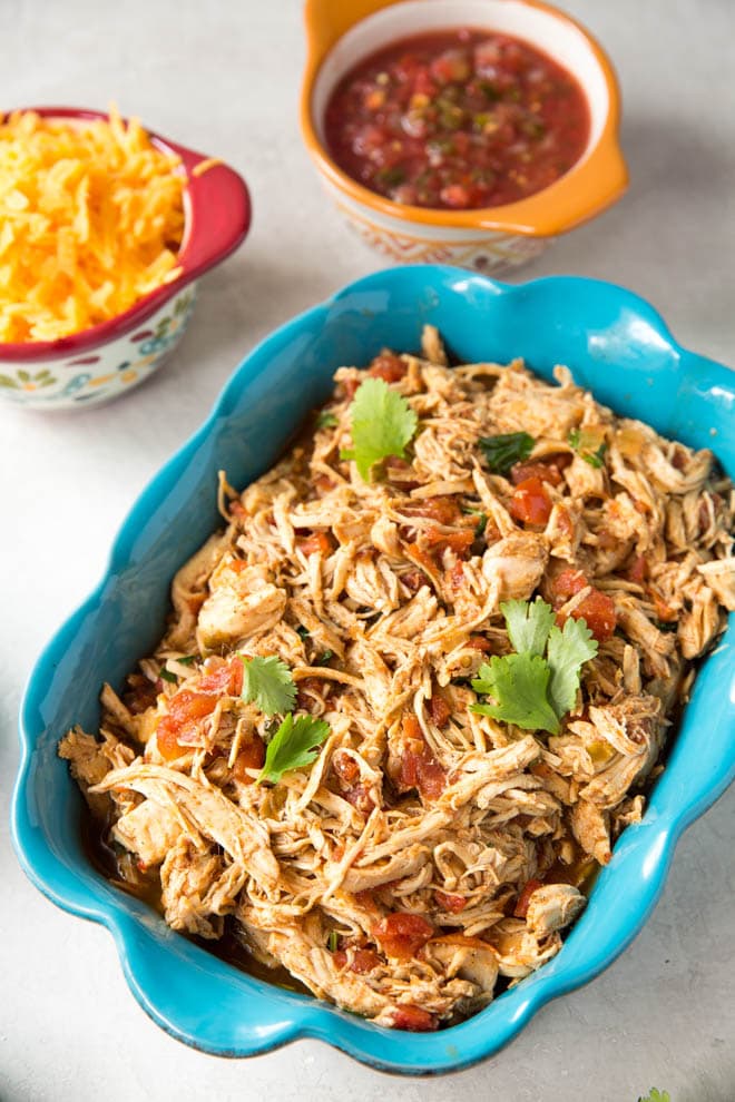 Crockpot chicken tacos are an easy dinner recipe that the entire family will love. Combine a few ingredients in your slow cooker for a delicious dinner recipe. #slowcooker #dinner #recipe #crockpot #chicken #tacos #healthy