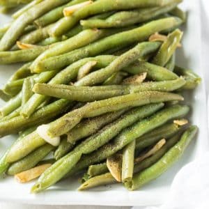 Follow this simple recipe for how to cook fresh green beans to make these Garlic Green Beans! The green beans cook in one skillet in less than 15 minutes. #garlic #greenbeans #sidedish #healthy #recipe