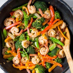 Shrimp Stir Fry with Lemon and Ginger is a simple yet healthy meal for any day of the week. Skip Chinese take out and make this classic at home. #shrimp #lemon #ginger #stirfry #vegetable #recipe #takeout #healthy #dinner #lunch #mealprep