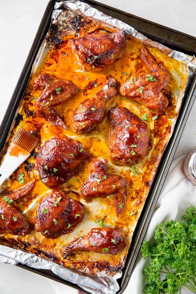 Baked bbq chicken includes an assortment of wings, drumsticks and thighs made with an easy bbq sauce. #bbq #chicken #wings #thighs #drumsticks #dinner #recipe #healthy
