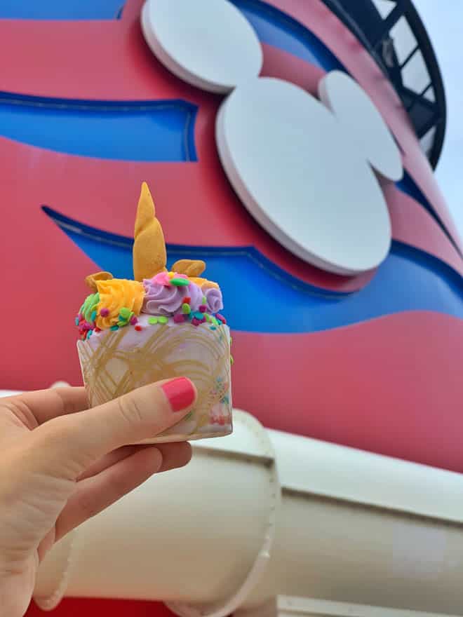 Unicorn cupcake in front of mickey ears on the Disney cruise ship
