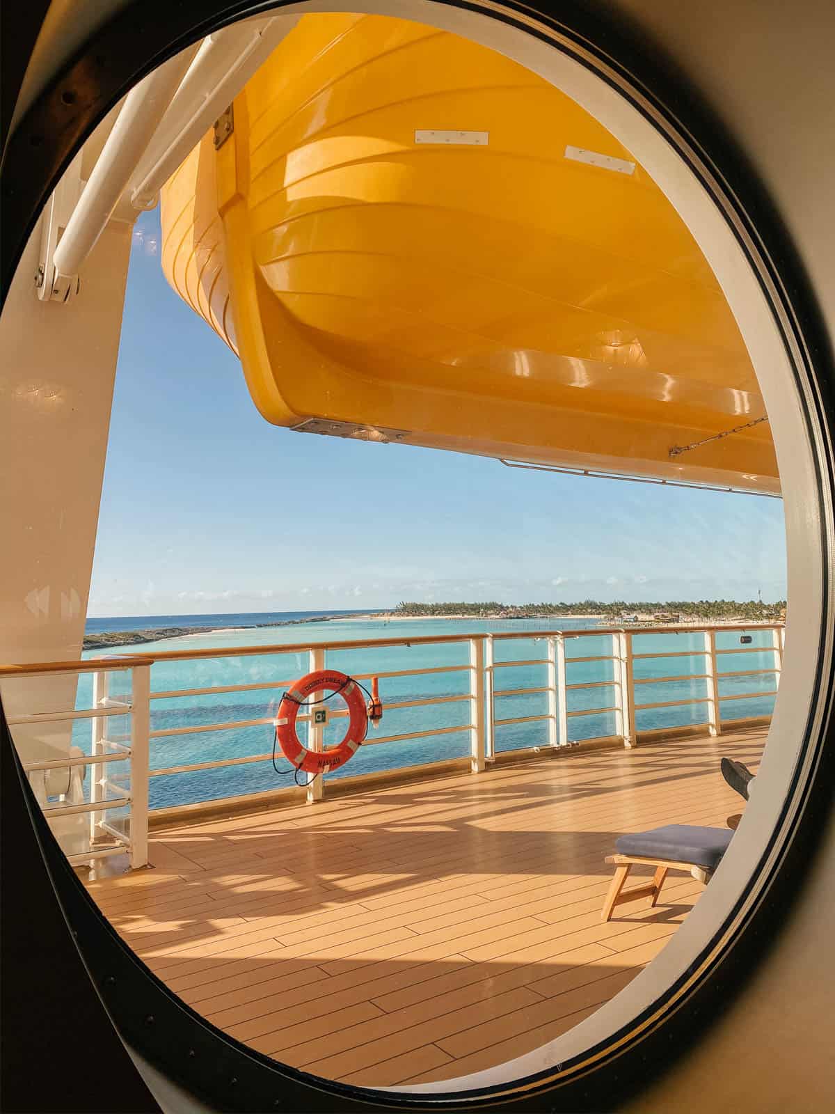 looking out port hole from disney dream cruise ship overlooking castaway cay