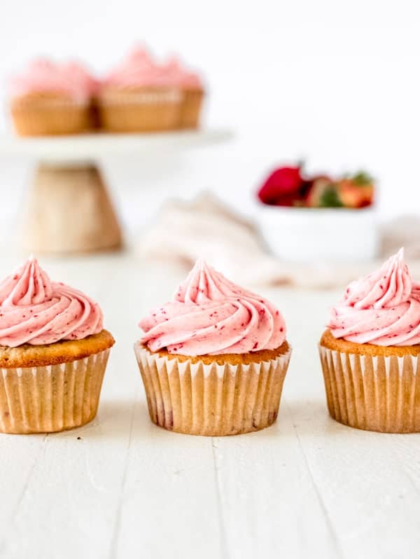 Three strawberry cupcakes