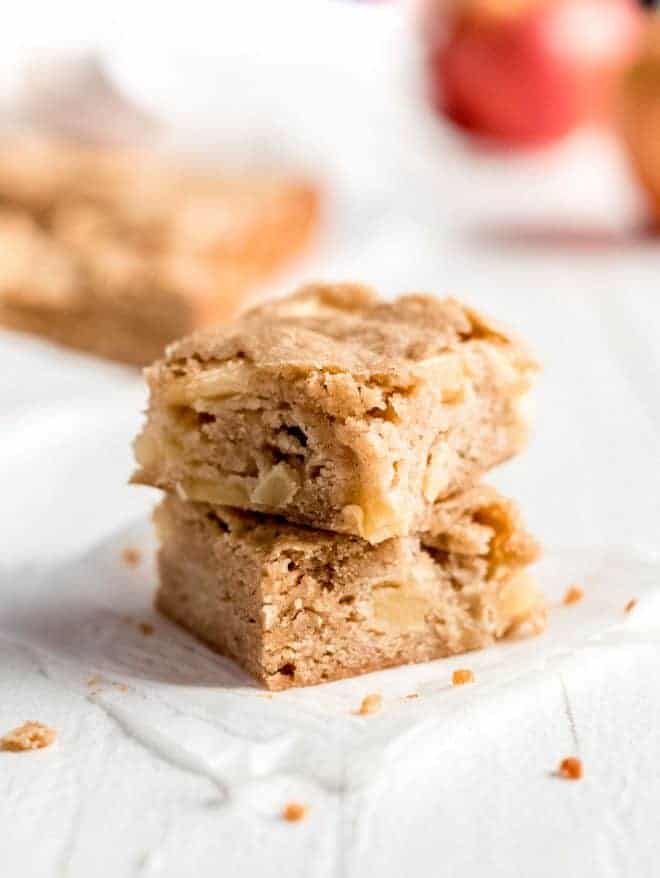 Two apple blondies on a white background.