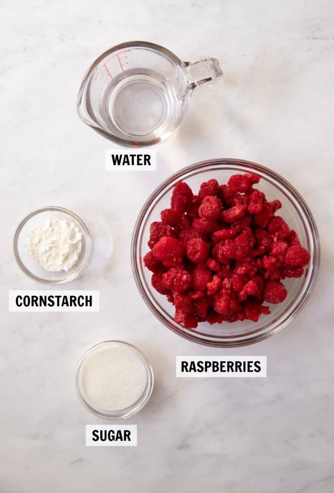 ingredients for raspberry sauce on tabletop