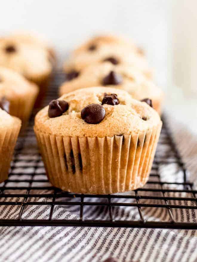 chocolate chip muffins on a baking rack