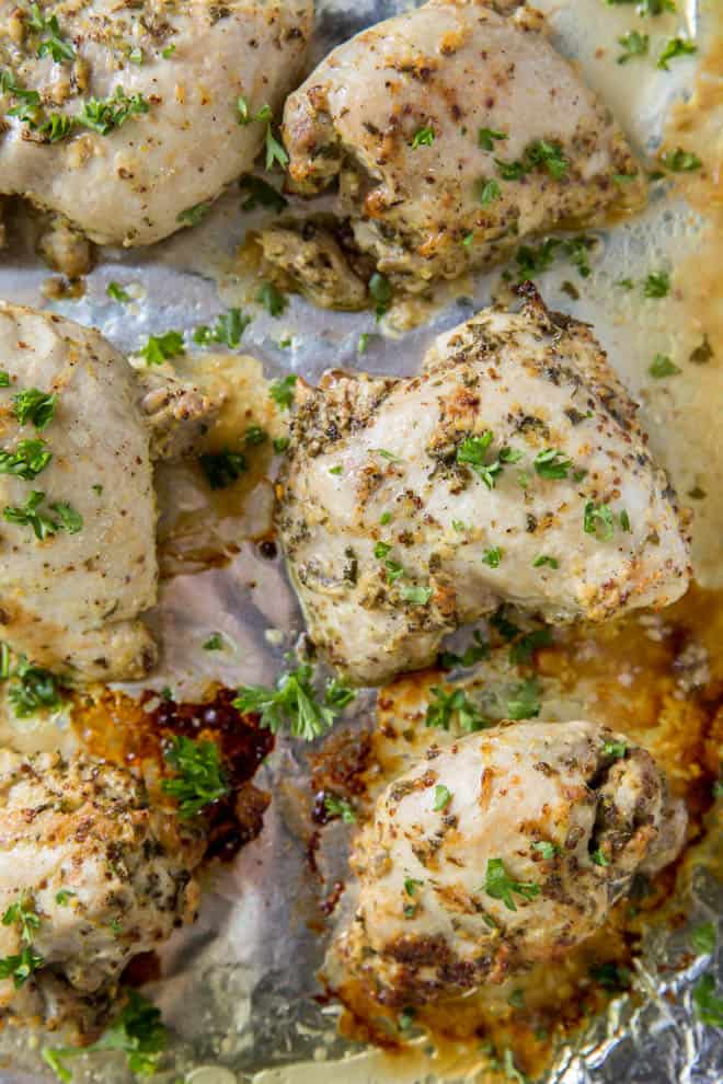 baked boneless chicken thighs on a sheet pan