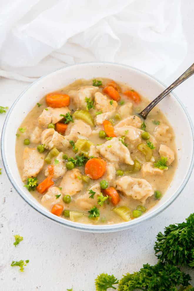 bowl filled with chicken and dumplings
