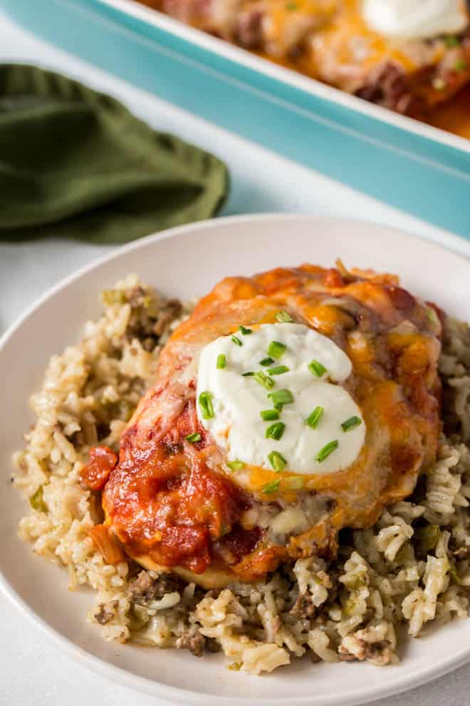 baked salsa chicken served over a bed of rice