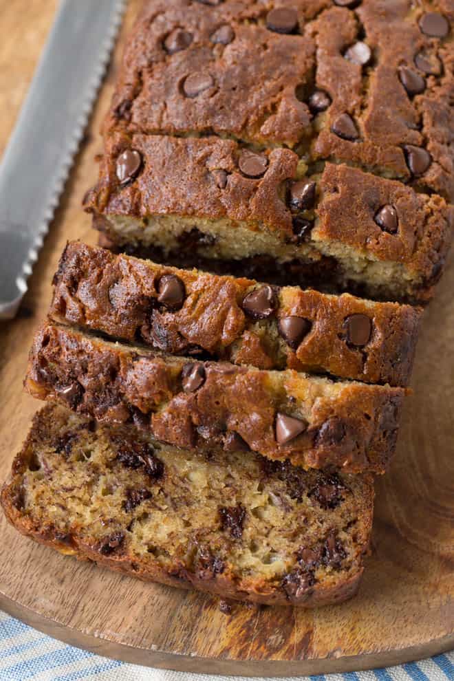 slicing into chocolate chip banana bread 