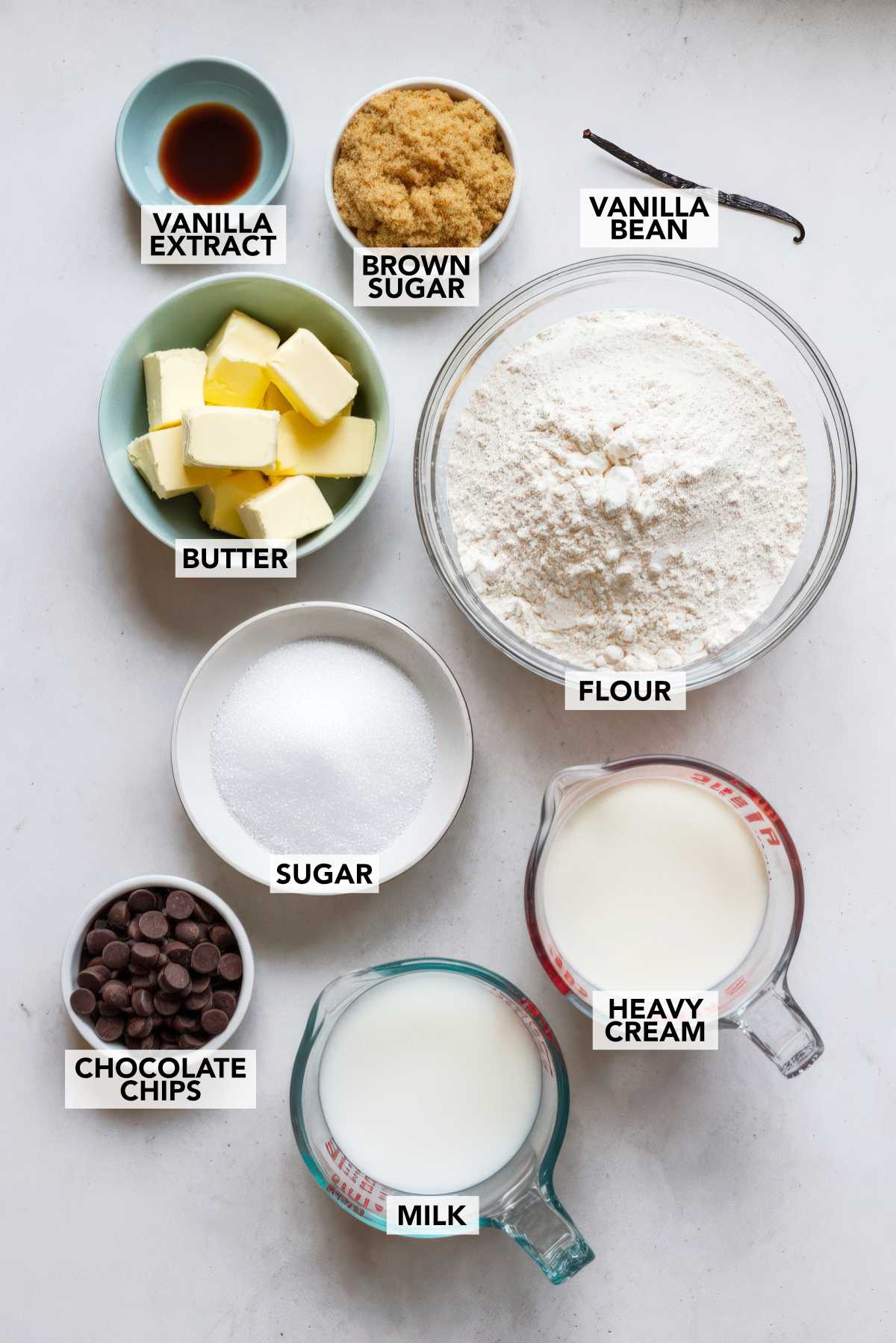 Ingredients for chocolate chip cookie dough ice cream including cream, milk, sugar, flour, butter, vanilla, and chocolate chips.