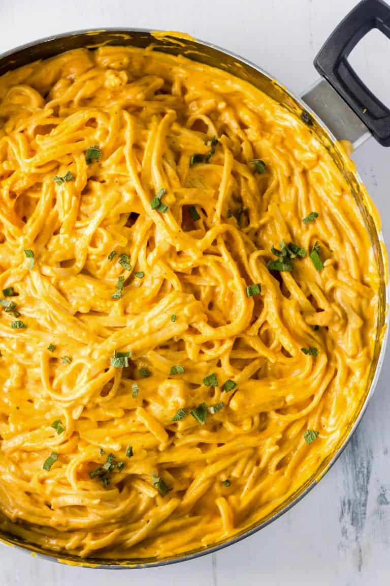 A large skillet with pumpkin pasta sauce ready for serving.